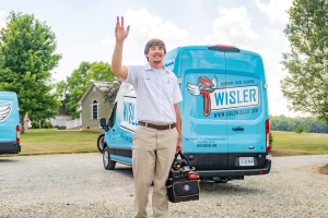 Wisler AC technician waiving hello.