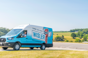 Wisler truck driving to a water heater repair.